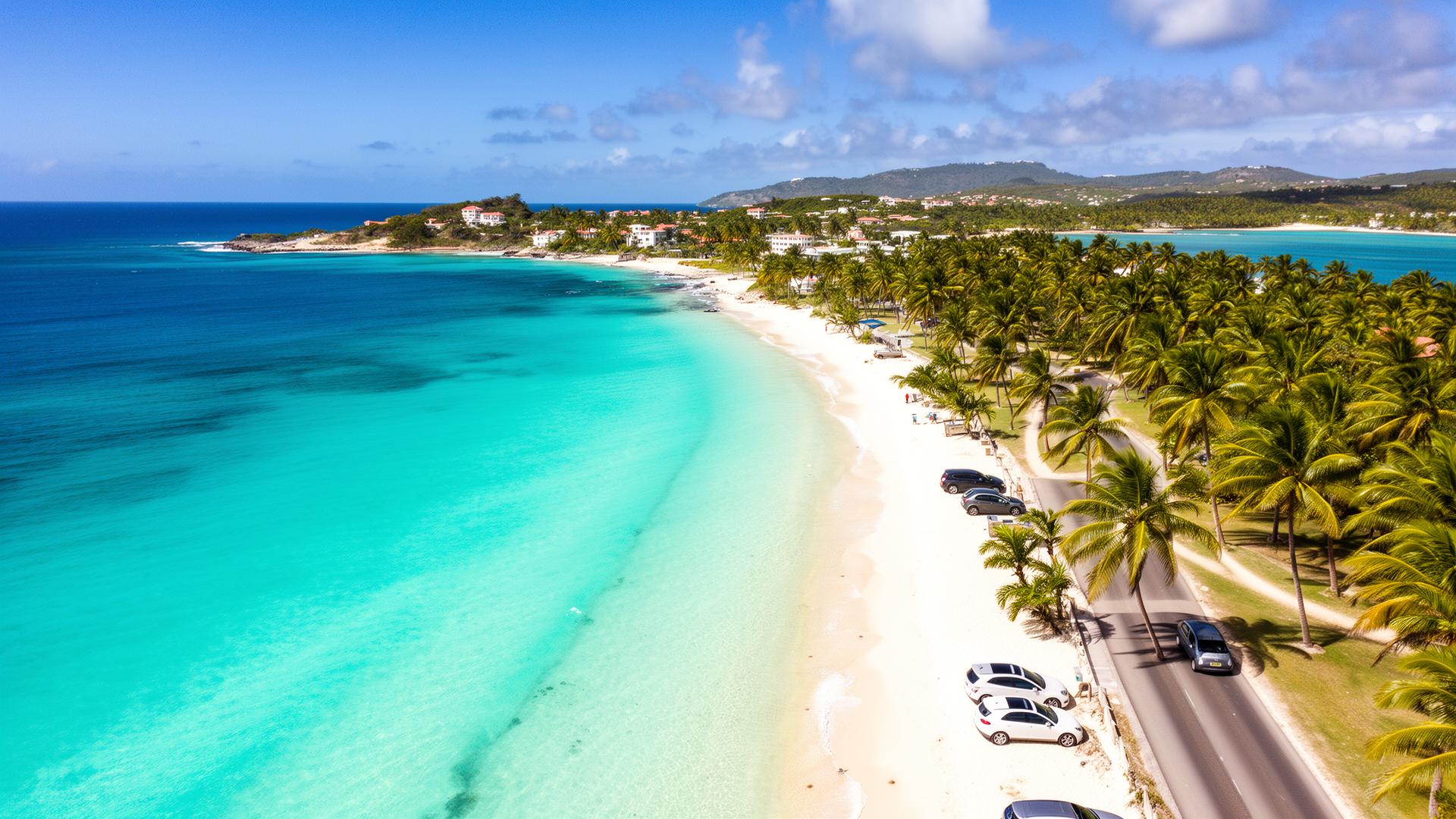 Aerial view of Barbados coastline with turquoise waters and cars along the road